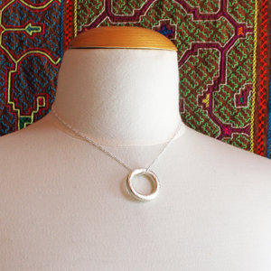 artisan hammered silver circle pendant