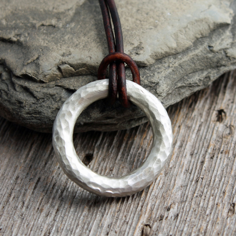 artisan hammered silver circle pendant with leather cord